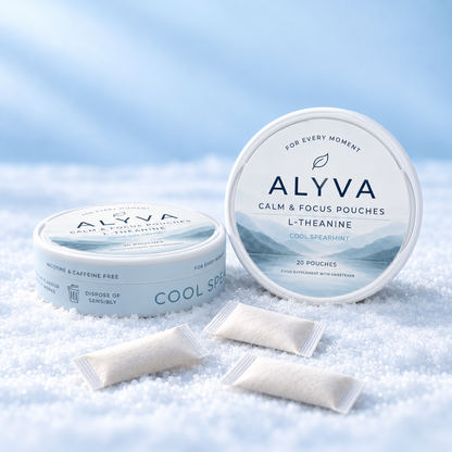 Two tins of ALYVA Cool Spearmint L-Theanine pouches with loose pouches on white crystals